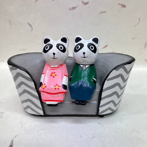 Cats, Bears and Pandas Sitting on Various Sofas