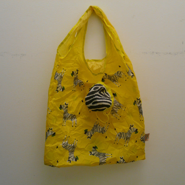 Yellow folding bag made from recycled plastic bottles, Zebra design, with pouch