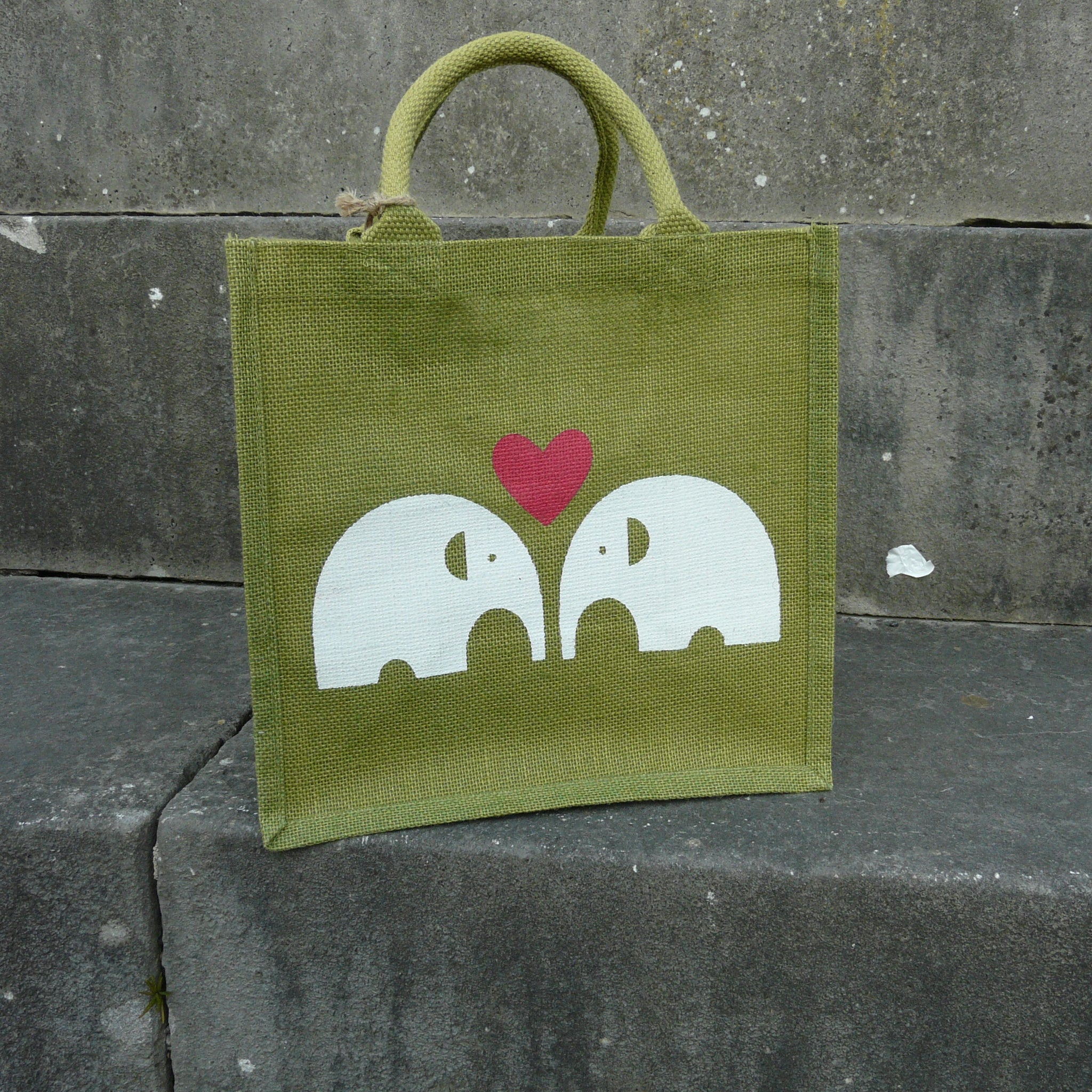 fair-trade-jute-shopping-bag-square-green-loveheart-2-white-elephants-facing