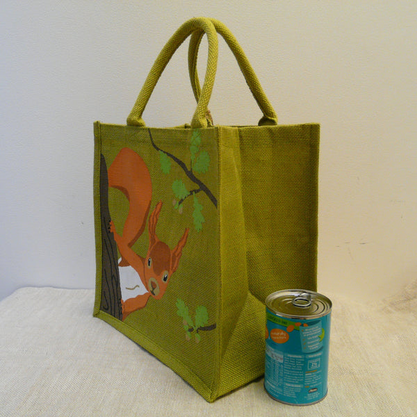 fair-trade-jute-shopping-bag-square-green-squirrel-looking-round-oak-tree-trunk-branches-with-oak-leaves-side-view