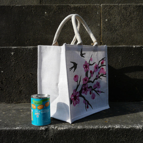 fair-trade-jute-shopping-bag-square-white-pink-cherry-blossom-swallows-sideview