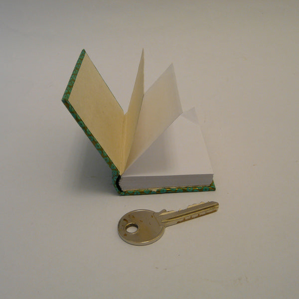 P1110375-fair-trade-lokta-paper-green-mini-notebook-open-with-key