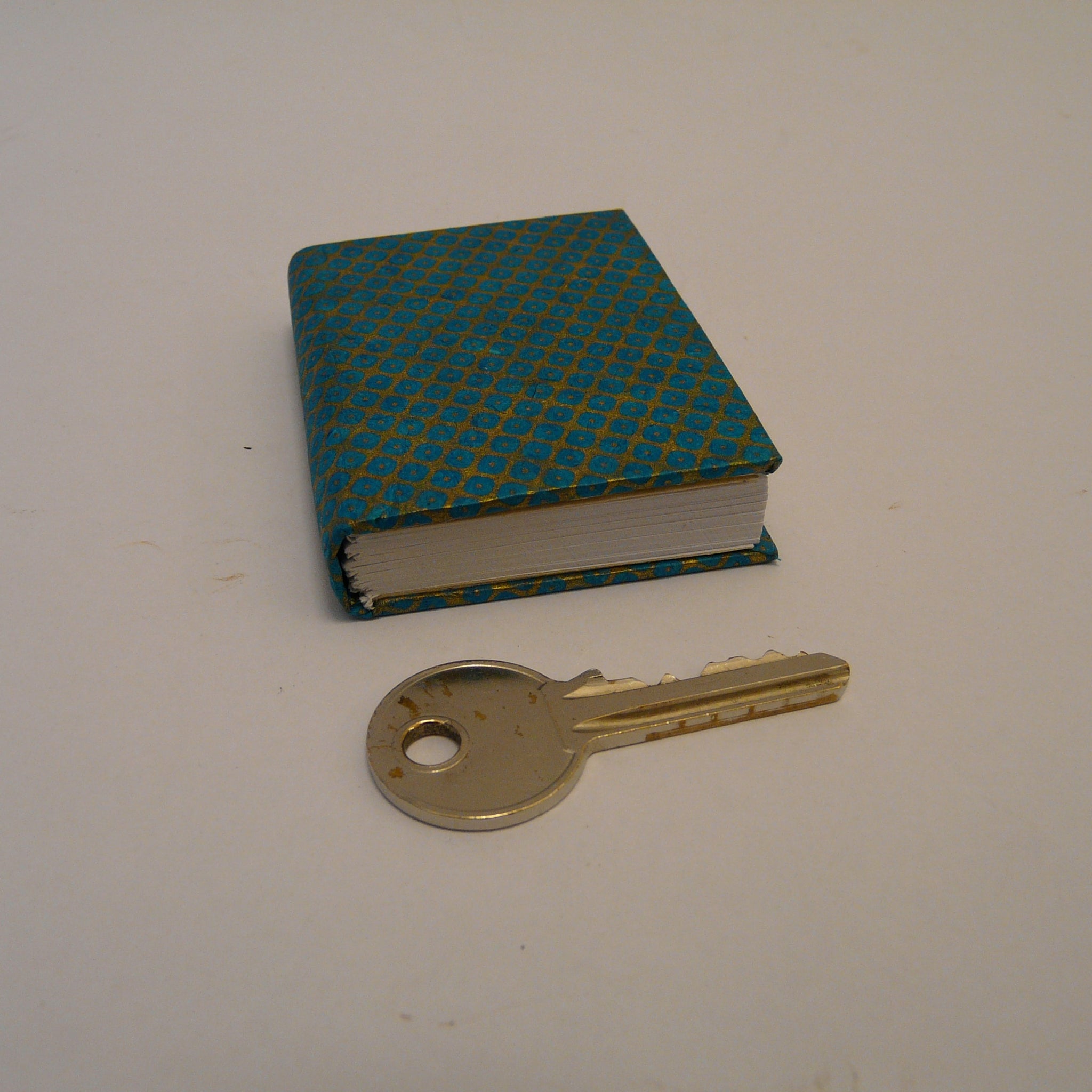 P1110376-fair-trade-lokta-paper-blue-mini-notebook-with-key