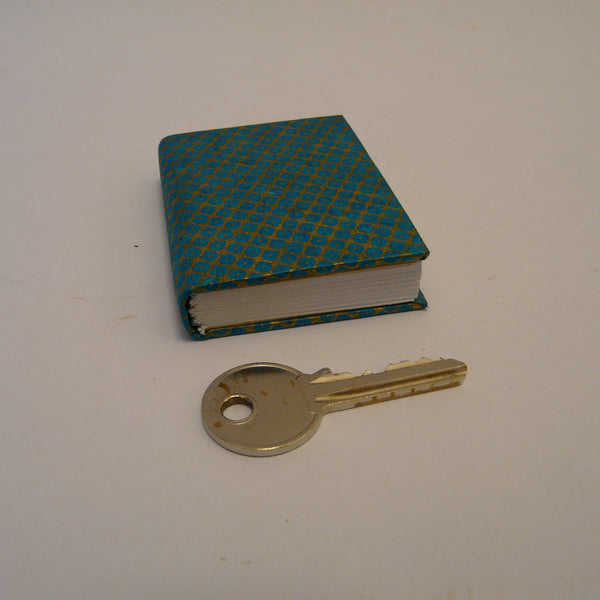 P1110376-fair-trade-lokta-paper-blue-mini-notebook-with-key