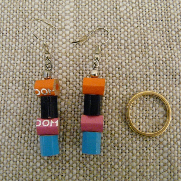 Pair of drop  earrings each with four pieces of crayon with ring to show size - three pieces size of ring (not included(