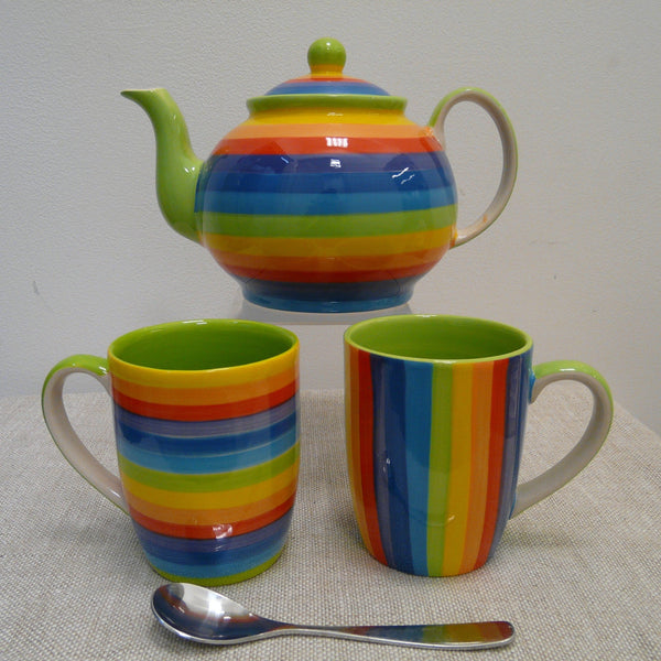 Ceramic-mugs-one-with-vertical-one-with-horizontal-rainbow-stripes-and-large-ceramic-teapot-with-horizontal-rainbow-stripes-green-spout-handle-green-on-upper-surface-natural-underside.
