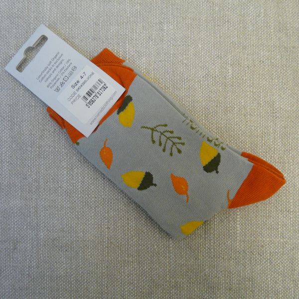 P1130728-Organic-Cotton-socks-4-7-Acorn-on-grey-rear.-Grey-socks-decorated-with-yellow-acorns-in-brown-cups,-pale-orange-leaves-and-pale-olive-green-fronds.-Orange-heals-orange-stretch-tops.